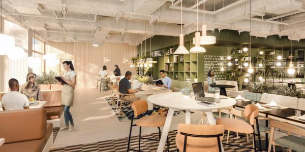 Modern ingericht café aan de Marten Meesweg met mensen die ontspannen werken, lezen en lunchen in een lichte, groene omgeving.